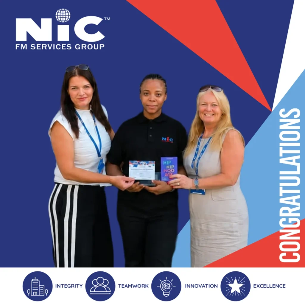 Loveth Nwaka receiving the Pride of NIC Award from NIC FM Services Group colleagues, celebrating Health & Safety excellence
